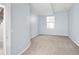 Light-blue bedroom with 1 window and light carpet at 9715 E 33Rd Ave, Denver, CO 80238