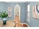 Dining room with seating for four, arched doorway to the kitchen and a view of the outdoors at 9715 E 33Rd Ave, Denver, CO 80238