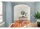 Open entryway featuring archways and hardwood floors providing a seamless transition between rooms at 9715 E 33Rd Ave, Denver, CO 80238