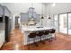 Spacious kitchen with a large island, seating, stainless steel appliances and access to outdoor space at 9715 E 33Rd Ave, Denver, CO 80238