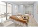 Well-lit home office with a wooden desk and comfortable seating, perfect for remote work at 9715 E 33Rd Ave, Denver, CO 80238