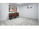 Spacious basement area with neutral carpet and large artwork; perfect for versatile use at 561 Saulsbury St, Lakewood, CO 80226