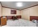 This cozy bedroom features muted wallpaper, shutters on the window, and ample closet space at 561 Saulsbury St, Lakewood, CO 80226
