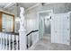 Elegant hallway with decorative lighting, carpet flooring and patterned wallpaper at 561 Saulsbury St, Lakewood, CO 80226