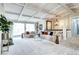 Spacious living room with coffered ceilings, large windows, and comfortable seating arrangements at 561 Saulsbury St, Lakewood, CO 80226