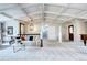 Bright and airy living room featuring high ceilings, plush carpeting, and an elegant chandelier at 561 Saulsbury St, Lakewood, CO 80226