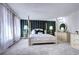 Spacious main bedroom with a four-poster bed, sheer curtains, and modern decor at 561 Saulsbury St, Lakewood, CO 80226