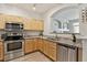 Well-equipped kitchen with stainless steel appliances and granite countertops at 12711 Colorado Blvd # H804, Thornton, CO 80241