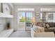 Bright living room with patio access, stylish decor, and comfortable seating arrangements at 12711 Colorado Blvd # H804, Thornton, CO 80241