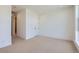 Light-filled, carpeted bedroom with neutral walls and minimal decor at 20588 E 63Rd Ave, Aurora, CO 80019