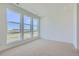 Carpeted bedroom with large windows providing plenty of natural light and open view at 20588 E 63Rd Ave, Aurora, CO 80019