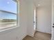 Bright foyer features hardwood floors and a large window with natural light at 20588 E 63Rd Ave, Aurora, CO 80019