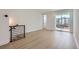 Upstairs living room with sliding glass doors leading to balcony with metal railings at 20588 E 63Rd Ave, Aurora, CO 80019