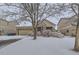 Lovely home with snow-covered yard, creating a picturesque winter scene at 14931 E 117Th Ave, Commerce City, CO 80603