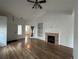 Inviting living room featuring wood floors and a fireplace at 14931 E 117Th Ave, Commerce City, CO 80603