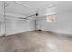 Spacious and empty two car garage with an automatic door opener at 6684 S Buffalo Dr, Littleton, CO 80120