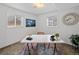 A naturally-lit home office complete with desk, chair, and decorative art at 6684 S Buffalo Dr, Littleton, CO 80120
