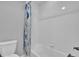 Clean bathroom with a white tiled shower and toilet at 2602 Meadows Blvd # A, Castle Rock, CO 80109