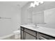 Contemporary bathroom with a white countertop, dark cabinets, and a shower-tub combination at 2602 Meadows Blvd # A, Castle Rock, CO 80109