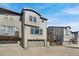 Modern home exterior featuring a multi-car garage and a sleek architectural design at 2602 Meadows Blvd # A, Castle Rock, CO 80109