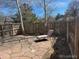 Backyard patio with stone pavers, lounge chair, and wooden fence at 751 Eudora St, Denver, CO 80220