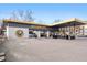 Einstein Bros. Bagels exterior with drive-thru, outdoor seating and ample parking space at 751 Eudora St, Denver, CO 80220