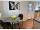 Compact dining area featuring a gray table, black chairs, and modern decor at 751 Eudora St, Denver, CO 80220