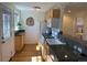 Functional kitchen with granite countertops, white appliances, and natural light at 751 Eudora St, Denver, CO 80220