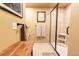 Bright bathroom featuring a glass-enclosed shower, stylish fixtures, and a convenient storage shelf at 1970 Woodbourne Ter, Castle Rock, CO 80104