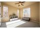 Sunlit bedroom with carpet flooring, a ceiling fan, and multiple windows at 1970 Woodbourne Ter, Castle Rock, CO 80104