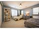 Cozy bedroom features two beds, dresser, bookshelf, and window with natural light at 1970 Woodbourne Ter, Castle Rock, CO 80104