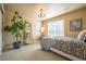 Bright bedroom features a patterned bedspread, large window, and ladder shelf at 1970 Woodbourne Ter, Castle Rock, CO 80104