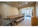 Dining room with a long table, decorative light fixture, and access to the outdoor space at 1970 Woodbourne Ter, Castle Rock, CO 80104