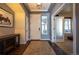 Welcoming entryway featuring a tiled floor, decorative console table, and ample natural light at 1970 Woodbourne Ter, Castle Rock, CO 80104