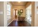 Inviting entryway with hardwood floors, neutral walls, and a view into other rooms at 1970 Woodbourne Ter, Castle Rock, CO 80104