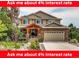 Charming two-story home with a well-manicured front yard and a welcoming covered porch at 1970 Woodbourne Ter, Castle Rock, CO 80104