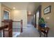 Upstairs hallway with a view down to the living room and nice decor at 1970 Woodbourne Ter, Castle Rock, CO 80104