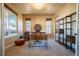 Bright home office with carpeted floors, large windows, and ample workspace for productivity at 1970 Woodbourne Ter, Castle Rock, CO 80104