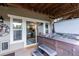 Inviting hot tub on a covered patio, offering a glimpse into the cozy kitchen through sliding glass doors at 1970 Woodbourne Ter, Castle Rock, CO 80104