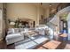 Expansive living room with open floor plan, hardwood floors and staircase at 1970 Woodbourne Ter, Castle Rock, CO 80104