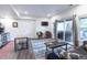 Bright living room featuring stylish chairs, a modern rug, and sliding glass doors to a patio with a hot tub at 1970 Woodbourne Ter, Castle Rock, CO 80104