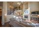 Bright and airy living room with a stone fireplace, hardwood floors, and comfortable seating at 1970 Woodbourne Ter, Castle Rock, CO 80104