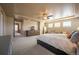 Spacious main bedroom boasts a ceiling fan, plenty of natural light and classic wood dresser at 1970 Woodbourne Ter, Castle Rock, CO 80104