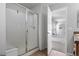 Bathroom with white tile shower and open doorway to bedroom at 17148 Waterhouse Cir # A, Parker, CO 80134