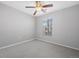 Neutral bedroom with carpet, ceiling fan, and bright window at 17148 Waterhouse Cir # A, Parker, CO 80134