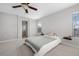 Bedroom featuring carpet, neutral walls, ceiling fan, and large windows at 17148 Waterhouse Cir # A, Parker, CO 80134