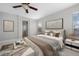 Well-lit bedroom featuring a comfortable bed and neutral color scheme at 17148 Waterhouse Cir # A, Parker, CO 80134