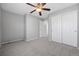 Neutral bedroom with carpet, ceiling fan, and closet with sliding doors at 17148 Waterhouse Cir # A, Parker, CO 80134