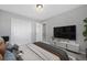 Relaxing bedroom with a closet, TV, and neutral color palette at 17148 Waterhouse Cir # A, Parker, CO 80134