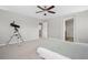 Bright bedroom with neutral walls and carpet, showing open doorways to the bathroom and closet at 17148 Waterhouse Cir # A, Parker, CO 80134